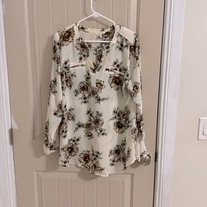 Cream colored long sleeve blouse